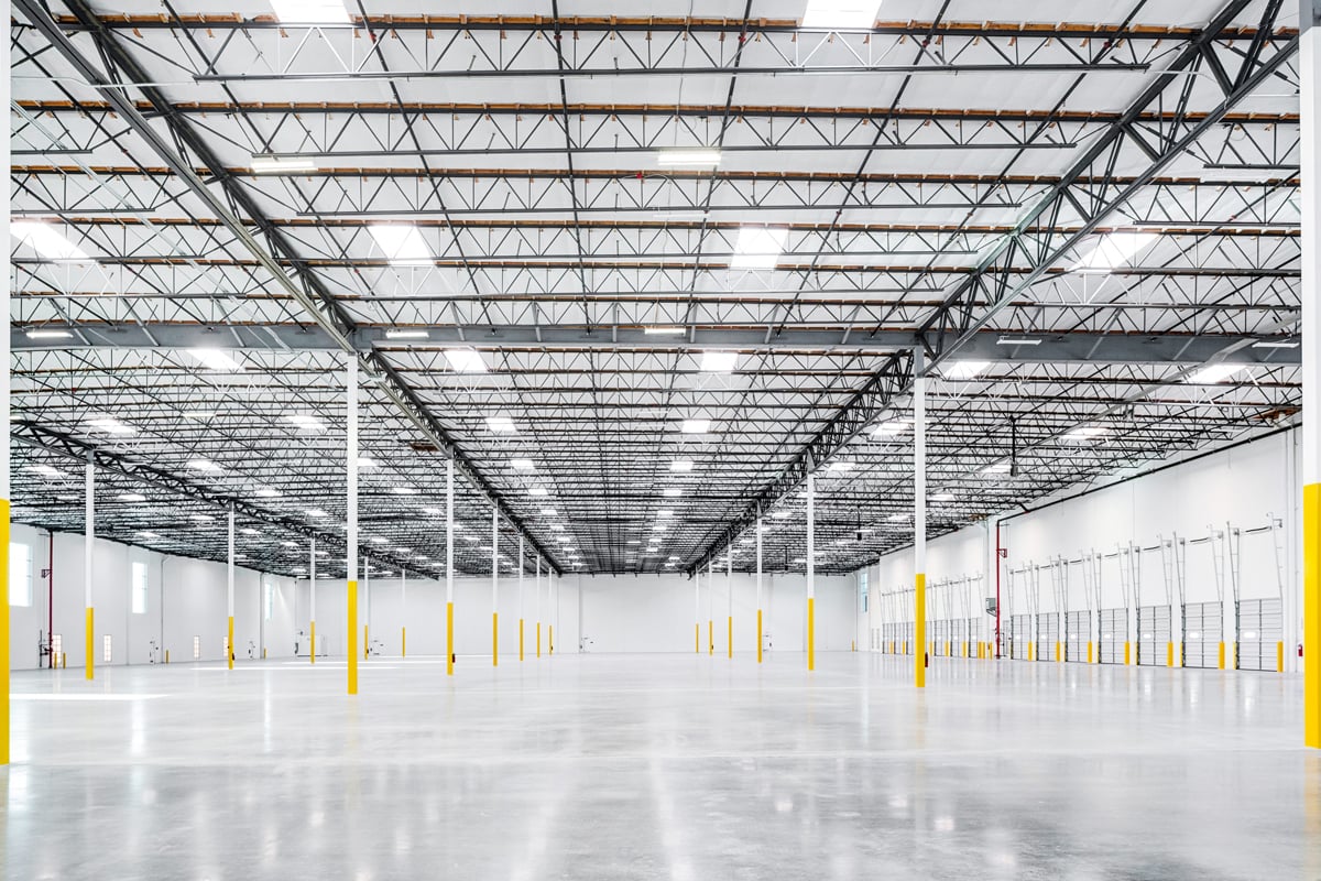 High-clear warehouse interior with column grid at 5235 E Hunter Ave